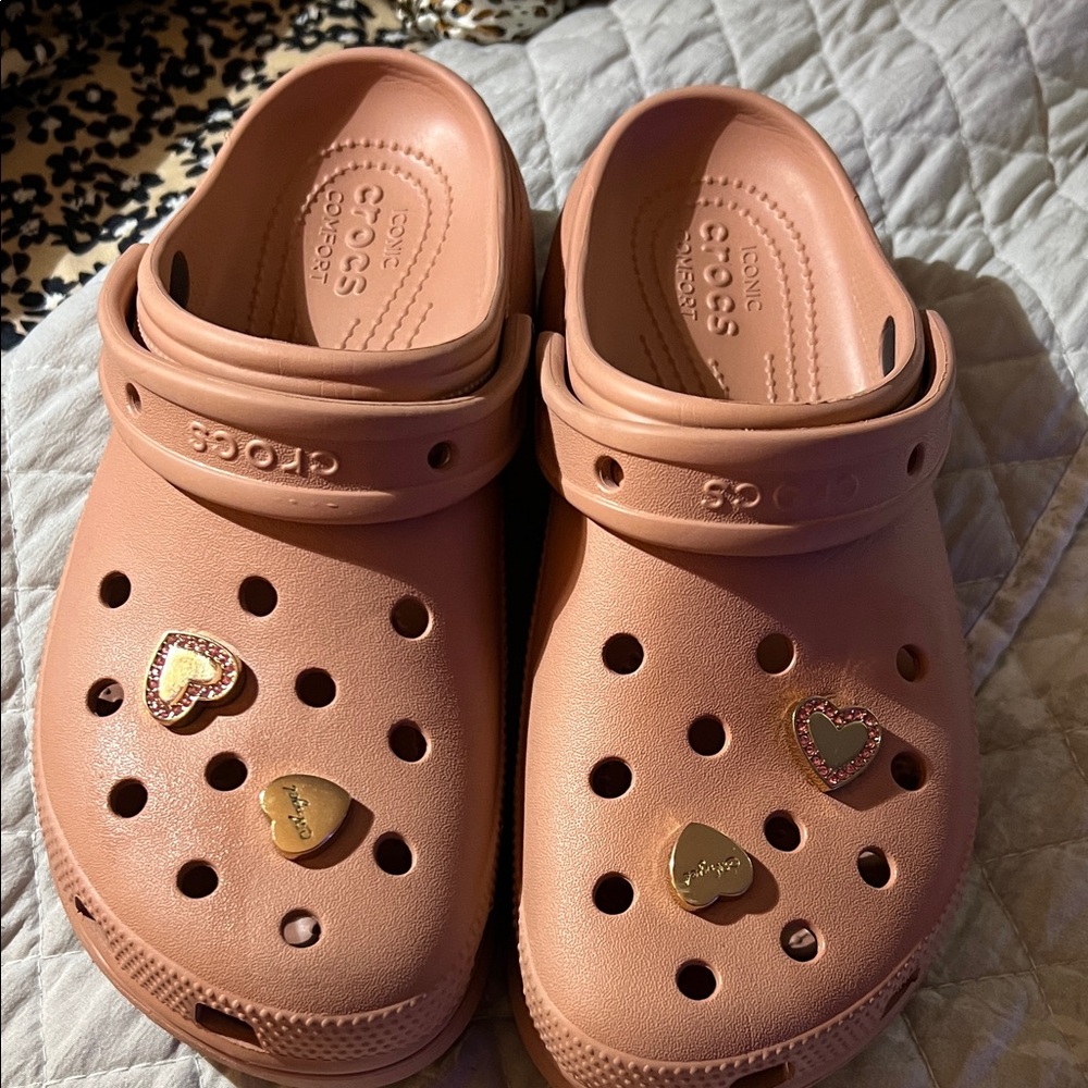 CROCS 
Women’s Rose color with charms